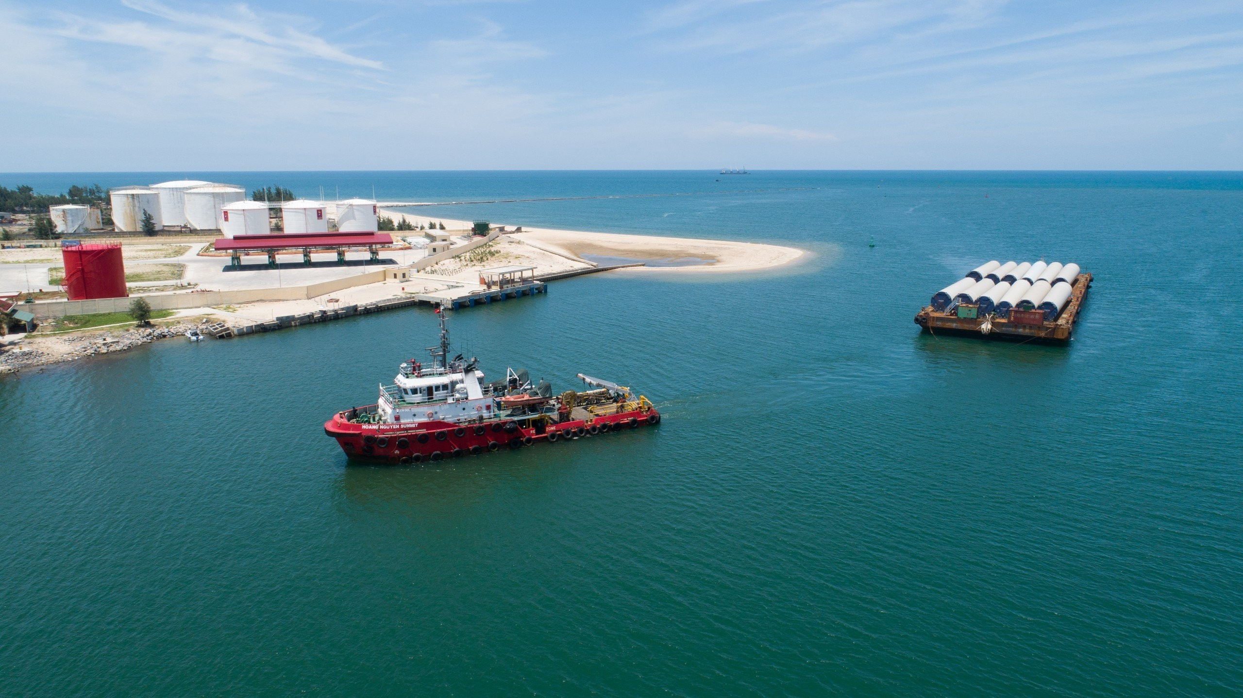 Wind turbine components moved by barge and tug